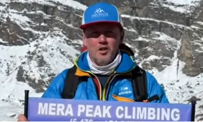 A successful climber stands on the summit of Mera Peak (6,476 m), sharing their Mera Peak Climbing Review after completing Nepal's highest trekking peak.