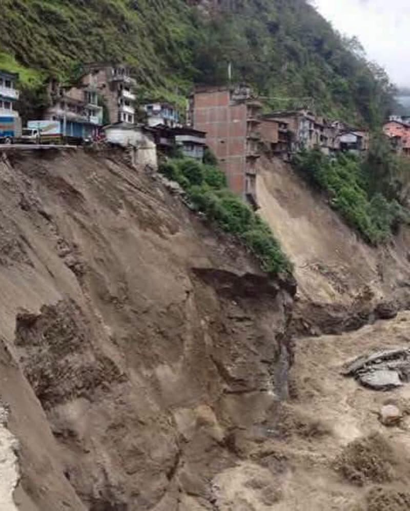 Road and house swept by flood in Rasuwa